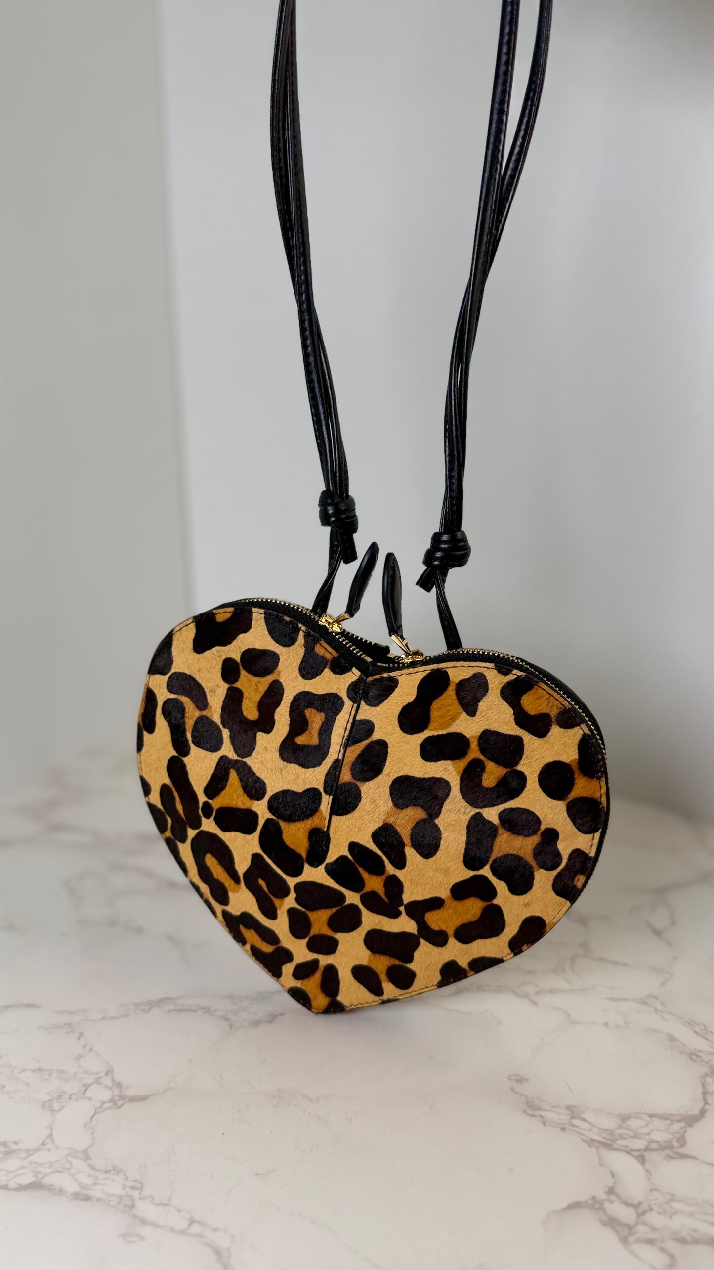 AlAIA heart pony hair bag