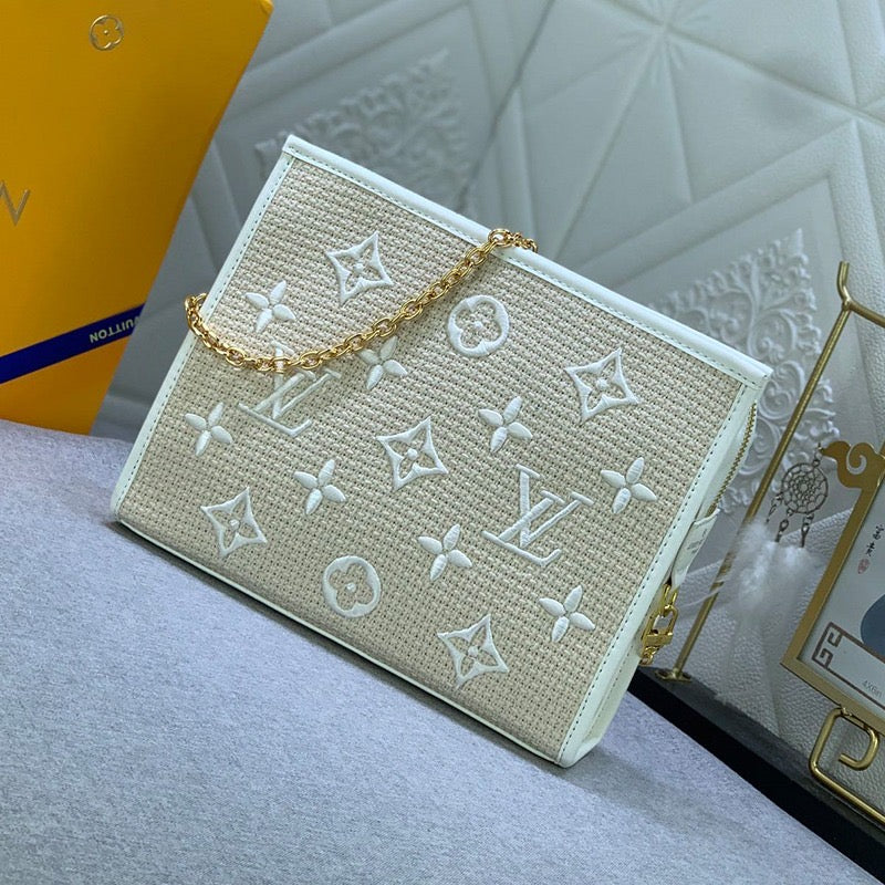 EMBROIDERED TOILETRY POUCH ON CHAIN