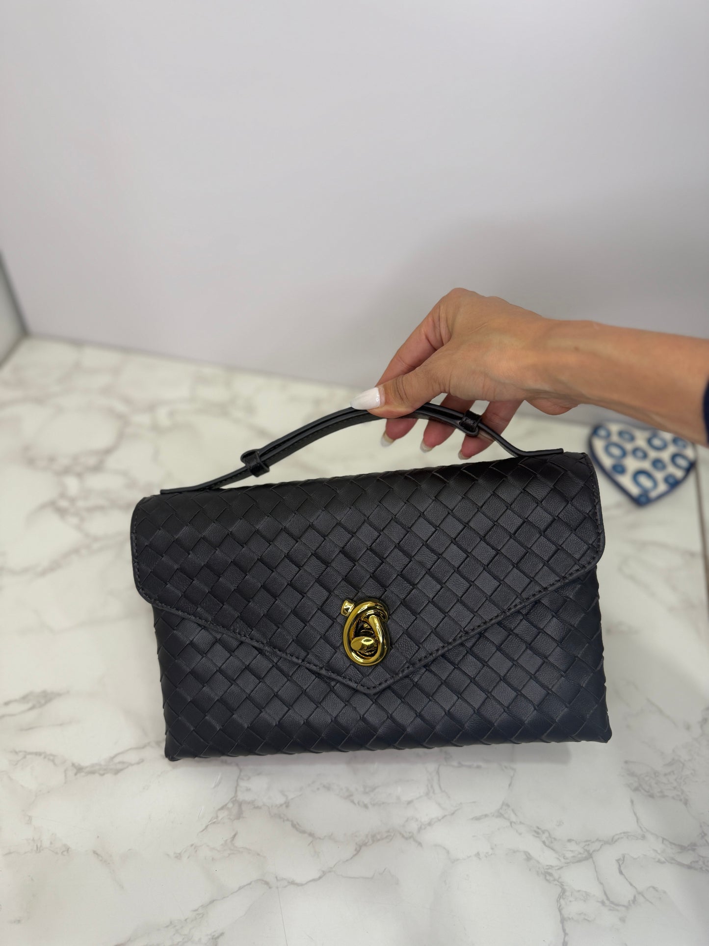 Bv woven knot clutch