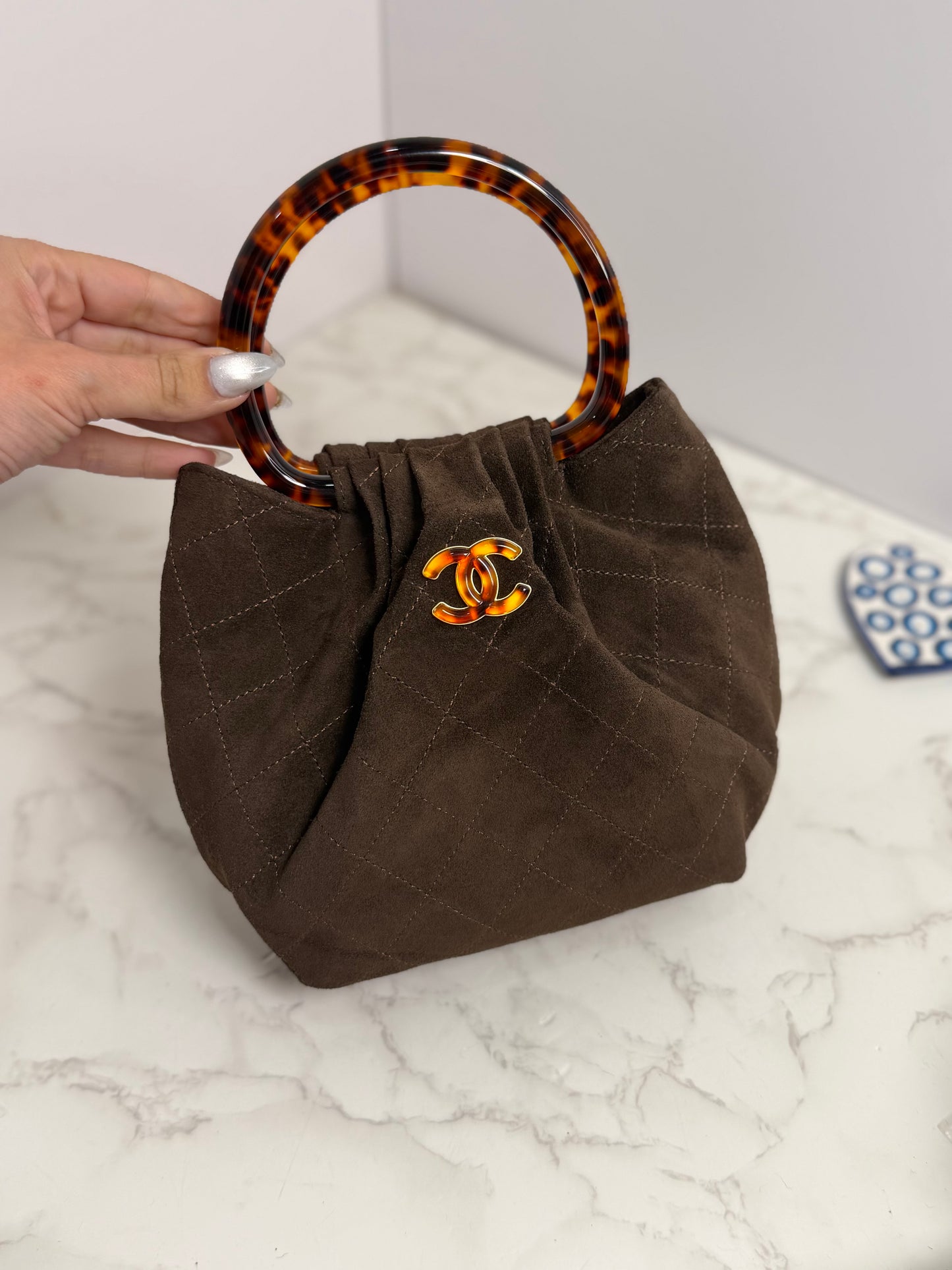 Cc suede tortoise bucket