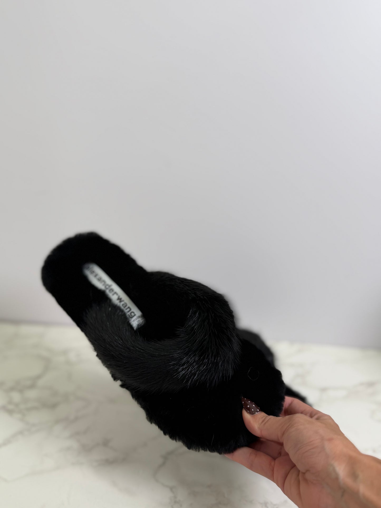 A Wang fur flip flops