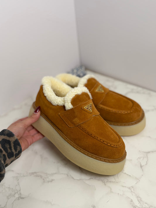 Prada platform Sherpa slip on