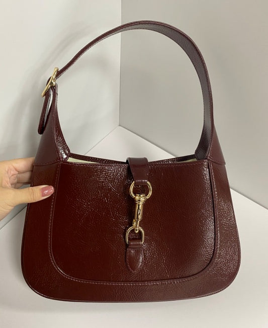 Patent shoulder bag