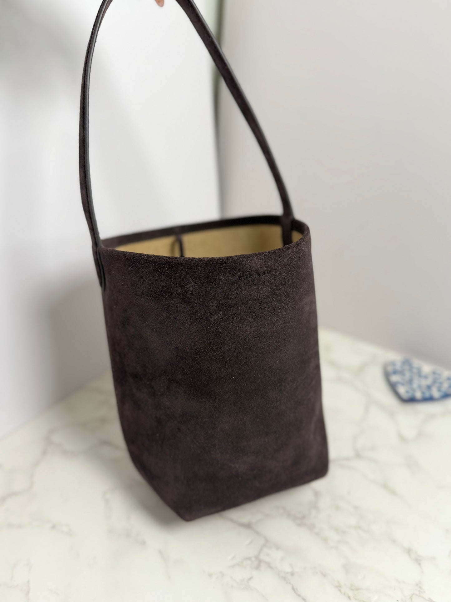 Row suede bucket bag