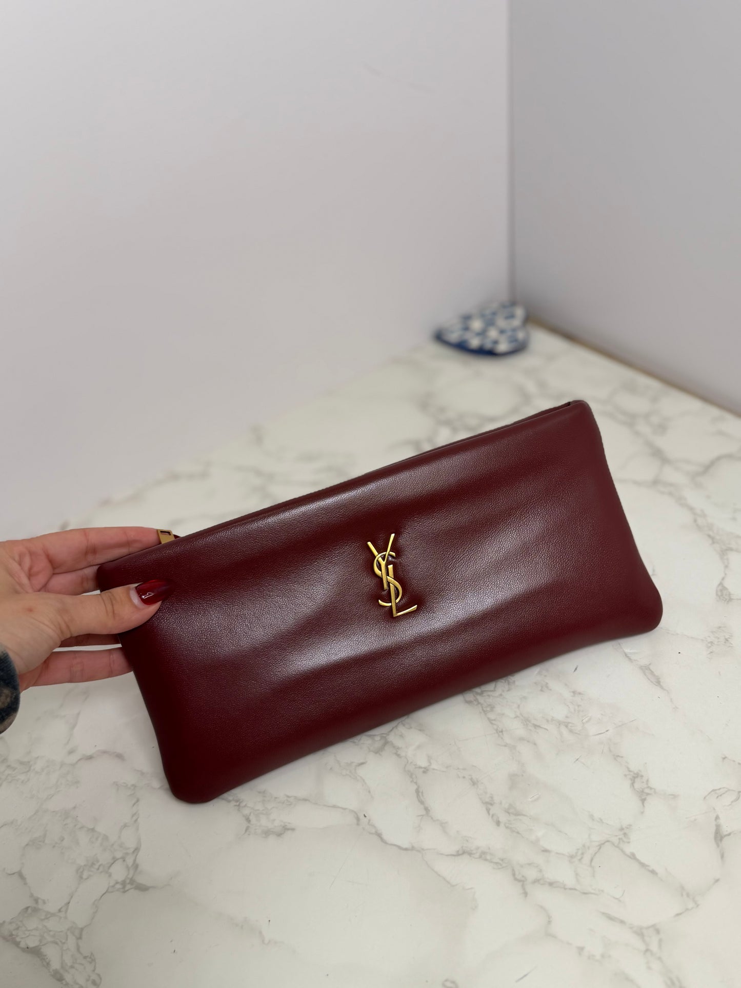 Ysl east west clutch